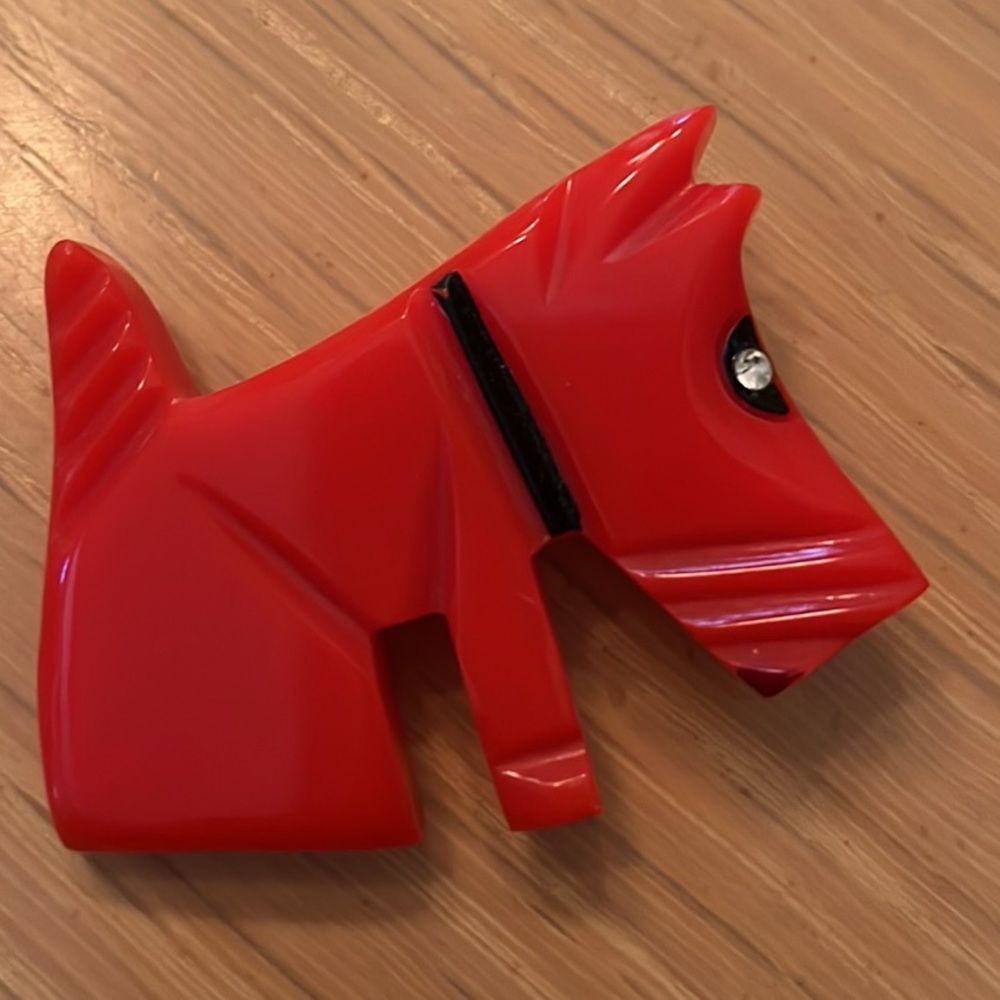 Vintage Bakelite Scotty, dog brooch in a vibrant, red color